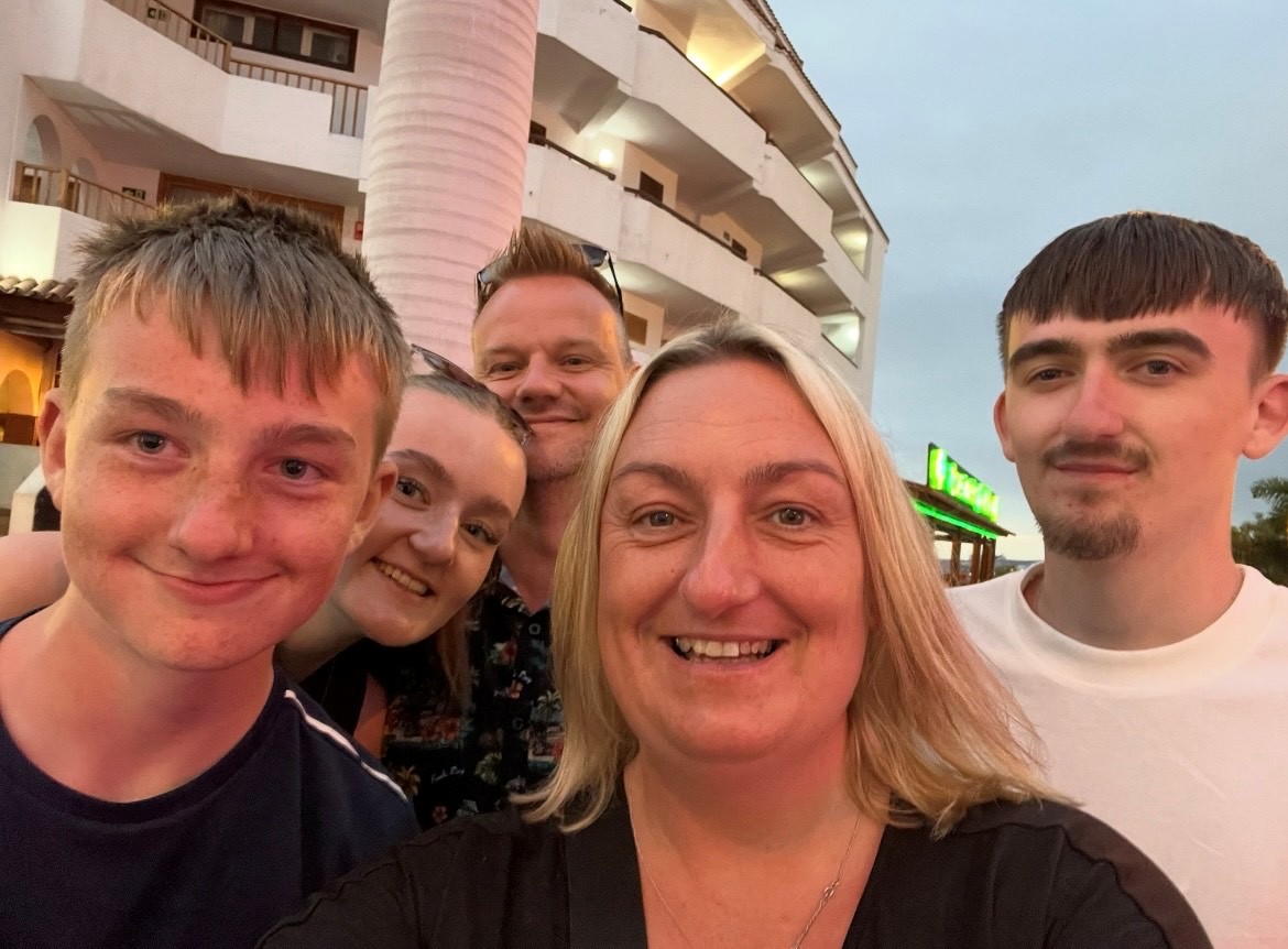 A selfie of a foster family of five